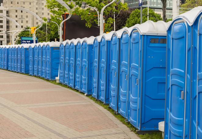 a row of portable restrooms set up for a special event, providing guests with a comfortable and sanitary option in Carpentersville