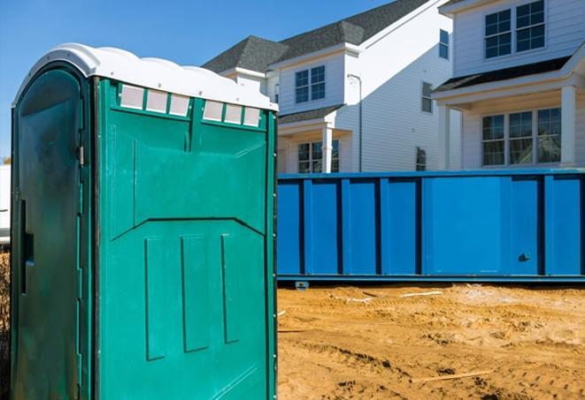 essential amenities at a bustling construction site porta potties